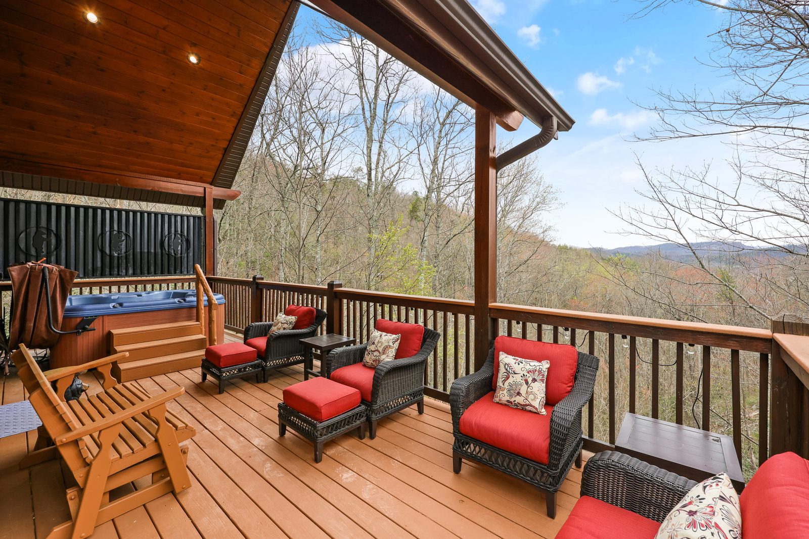 Deck seating with hot tub and valley view