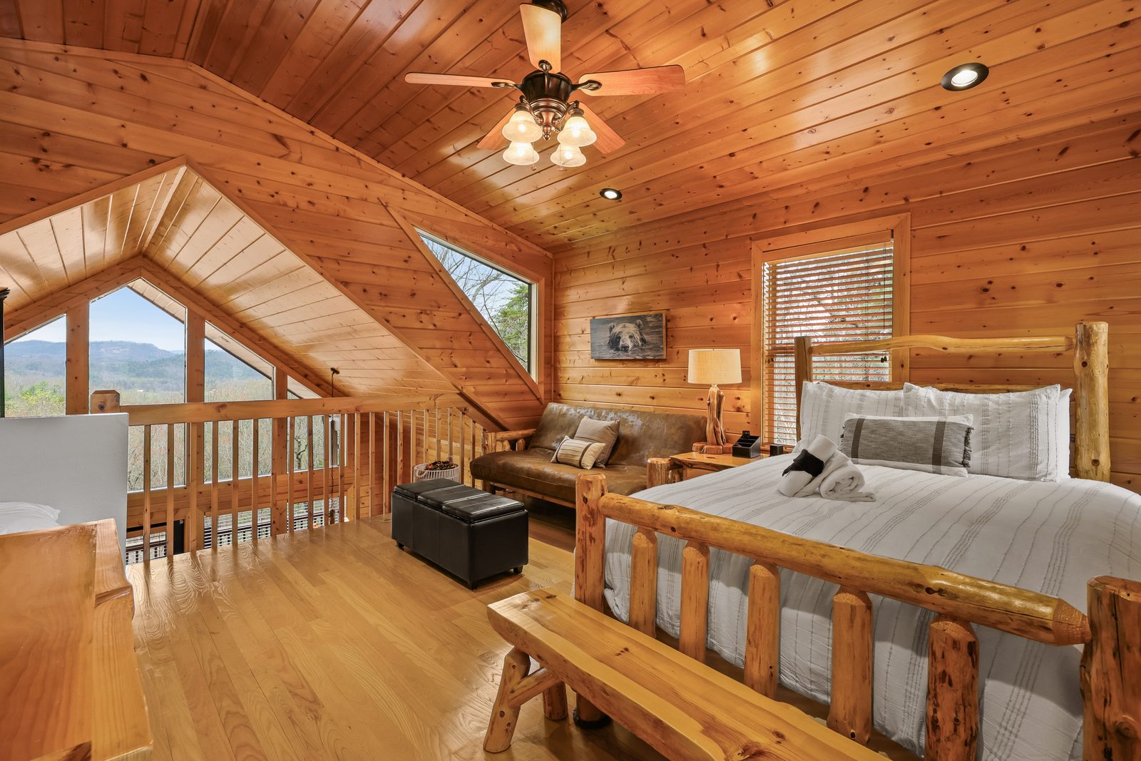 Loft bedroom with mountain-view window